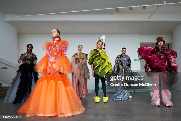 Student models display clothes ahead of the Fashion Design and Textile Design catwalk show at Glasgow School of Art on August 23, 2019 in Glasgow,...