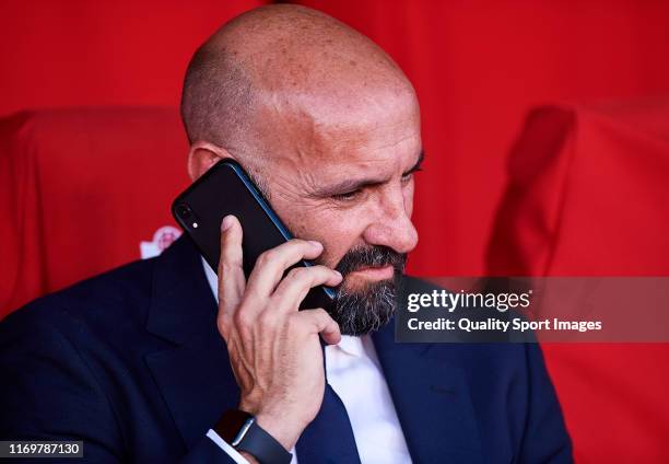 Sevilla FC Sport director Ramon Rodriguez 'Monchi' speaks on the phone prior the Liga match between Granada CF and Sevilla FC at Estadio Nuevo Los...