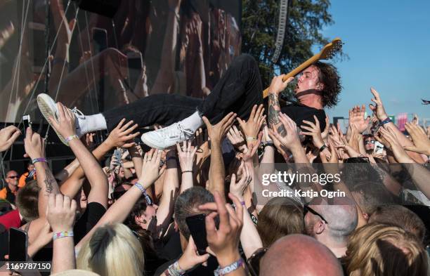 Dean Richardson of Frank Carter & The Rattlesnakes crowd surfs during their performance at Leeds Festival 2019 at Bramham Park on August 23, 2019 in...