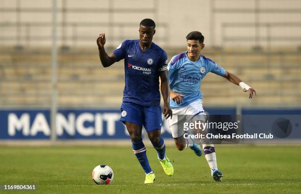 Marc Guehi of Chelsea FC battles with Nabil Touaizi of Manchester City during the Premier League 2 match between Manchester City and Chelsea at...