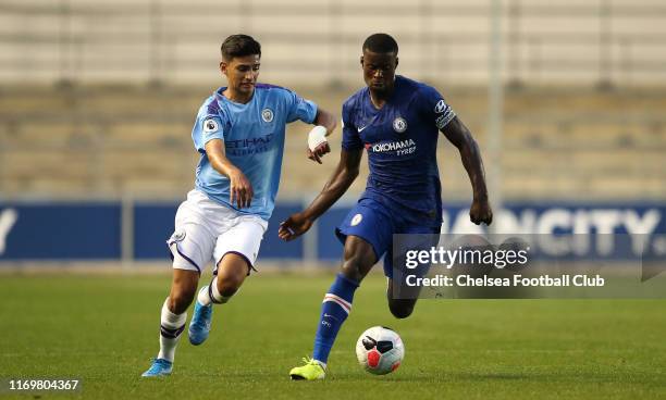 Marc Guehi of Chelsea FC battles with Nabil Touaizi of Manchester City during the Premier League 2 match between Manchester City and Chelsea at...