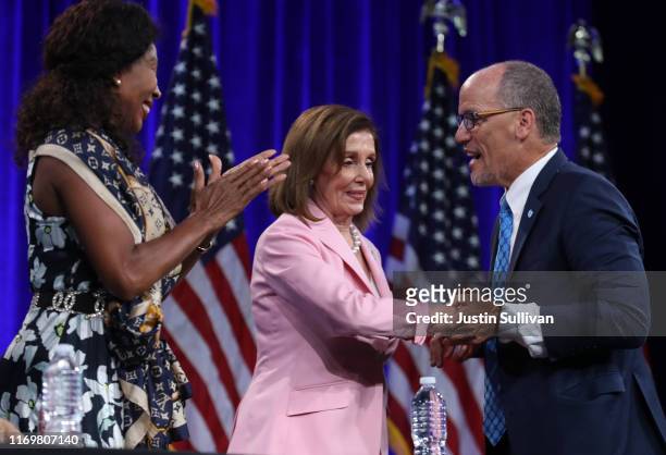 Speaker of the House Nancy Pelosi is greeted by Democratic National Committee chairman Tom Perez before speaking during the Democratic Presidential...
