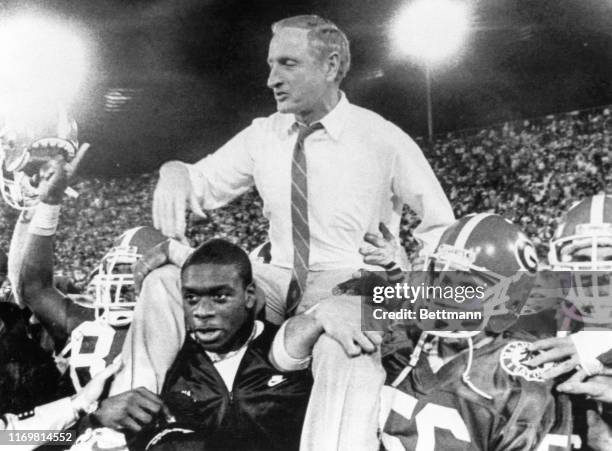 Georgia coach Vince Dooley is carried off the field by his players after his Bulldogs beat Michigan State 34-27 in the Gator Bowl. It was Dooley's...