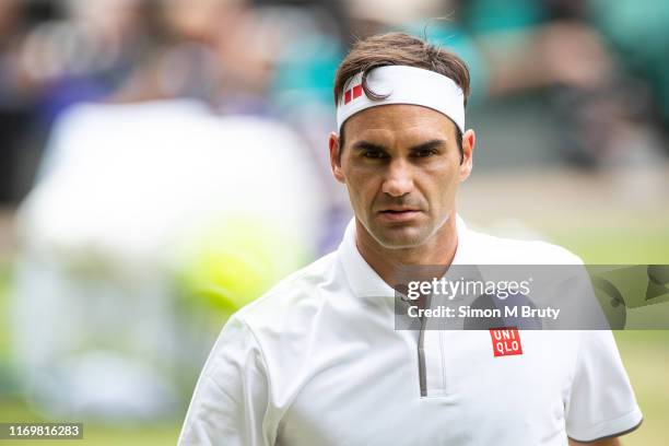 Roger Federer of Switzerland in action during the Men's Singles Final against Novak Djokovic of Serbia at The Wimbledon Lawn Tennis Championship at...