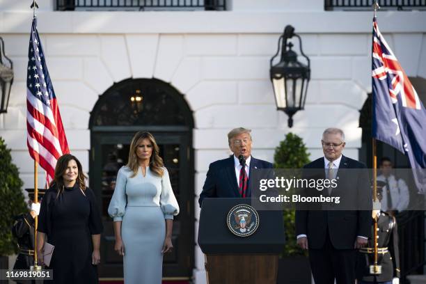 President Donald Trump speaks as Scott Morrison, Australia's prime minister, right, listens with his wife Jenny Morrison, left, and First Lady...