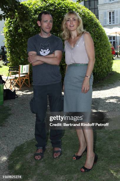 Mathieu Busson and Julie Gayet attend the Photocall of the movie "Filmmakers" during the 12th Angouleme French-Speaking Film Festival : Day Four on...