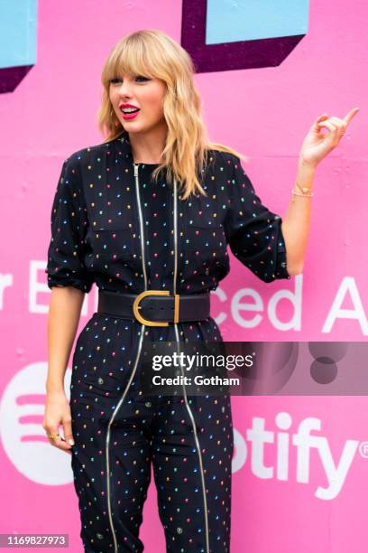 Taylor Swift poses in front of a mural introducing her latest album "Lover" on August 23, 2019 in in the Brooklyn borough of New York City.