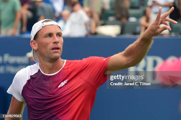 Lukasz Kubot of Poland celebrates after defeating Nicholas Monroe and Tennys Sandgren in the men's doubles championship final on day seven of the...