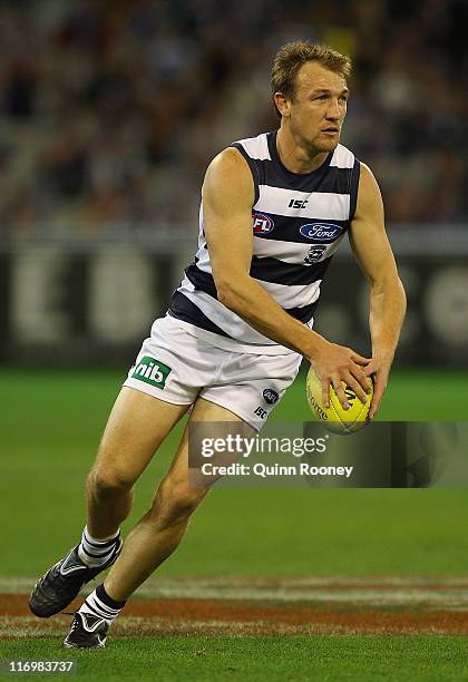 Darren Milburn of the Cats kicks during the round 13 AFL match between the St Kilda Saints and the Geelong Cats at the Melbourne Cricket Ground on...