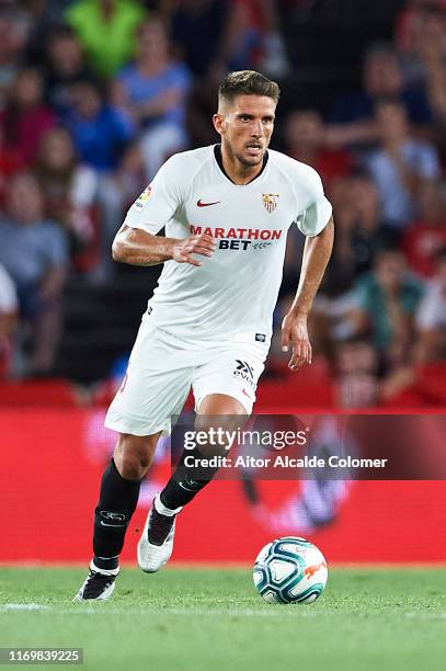 Daniel Carrico of Sevilla FC in action during the Liga match between Granada CF and Sevilla FC at Estadio Nuevos los Carmenes on August 23, 2019 in...