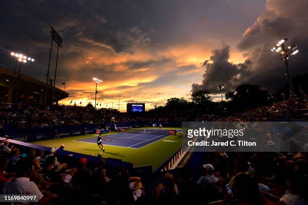 Benoit Paire of France returns a shot from Steve Johnson during their semifinals match on day seven of the Winston-Salem Open at Wake Forest...