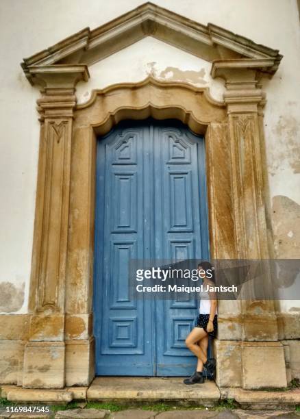 woman at a door in the colonial city of ouro preto, minas gerais state - brazil - black woman slave stock pictures, royalty-free photos & images