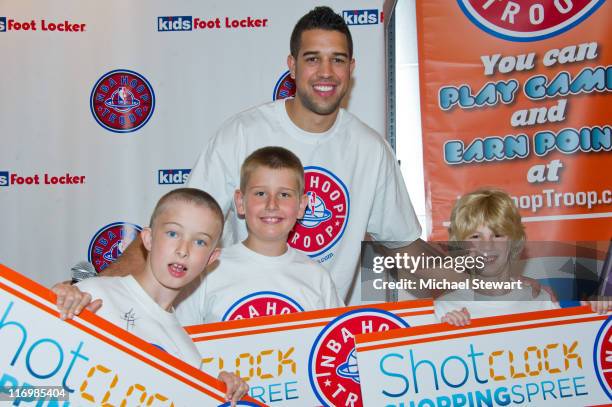 Andrew, Ian, NBA player Landry Fields and Jake attend the Shot Clock shopping spree at Kids Foot Locker, Herald Square on June 18, 2011 in New York...