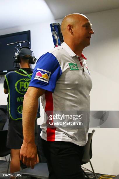 Knights coach Nathan Brown walks out of a press conference after the round 23 NRL match between the Wests Tigers and the Newcastle Knights at...