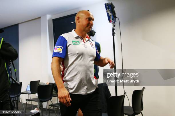 Knights coach Nathan Brown walks out of a press conference after the round 23 NRL match between the Wests Tigers and the Newcastle Knights at...