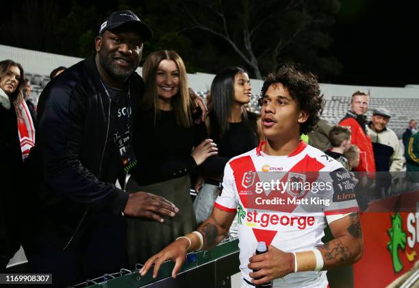 Tristan Sailor of the Dragons shakes hands with his father Wendell Sailor after the round 23 NRL match between the St George Illawarra Dragons and...