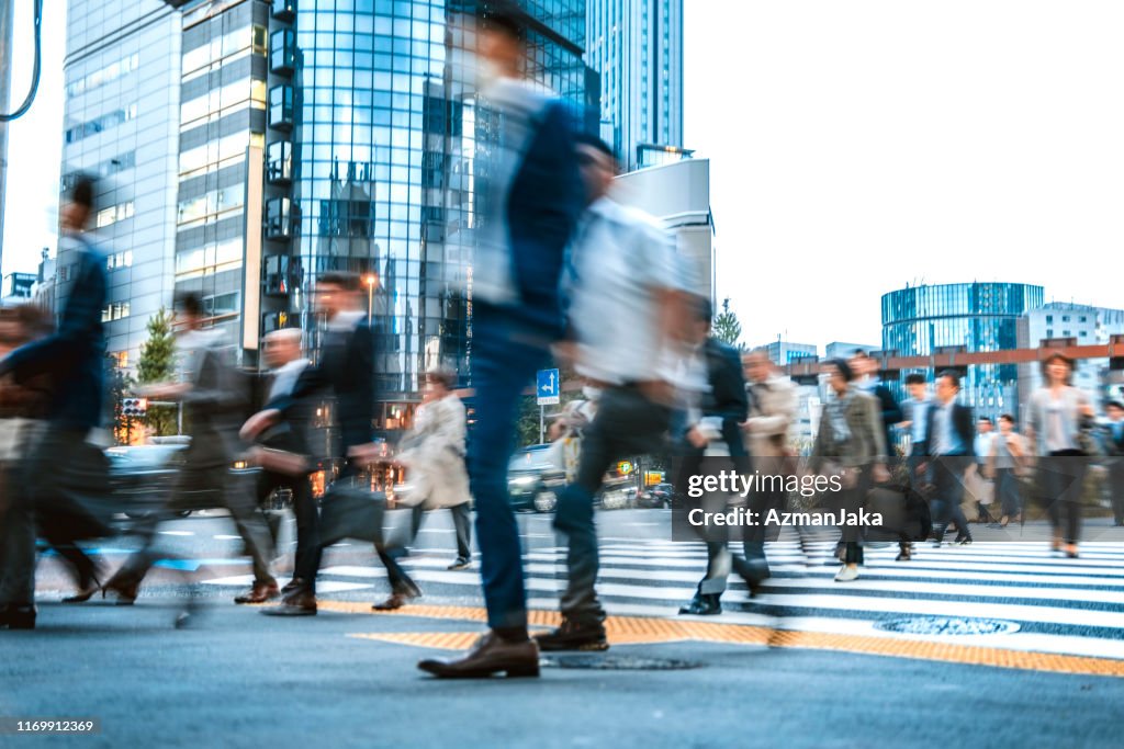 Blurred group of business people commuting on the streets of Japan
