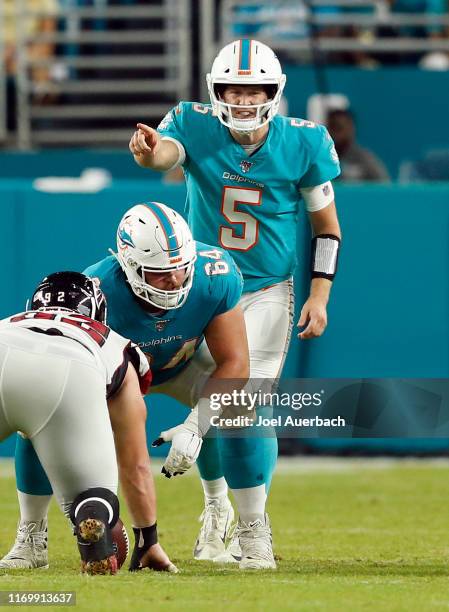 Jake Rudock of the Miami Dolphins calls a signal against the Atlanta Falcons during an NFL preseason game on August 8, 2019 at Hard Rock Stadium in...