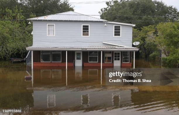 House sits on the flooded waters on highway 124 on September 20, 2019 in Beaumont, Texas. Gov. Greg Abbott has declared much of Southeast Texas...