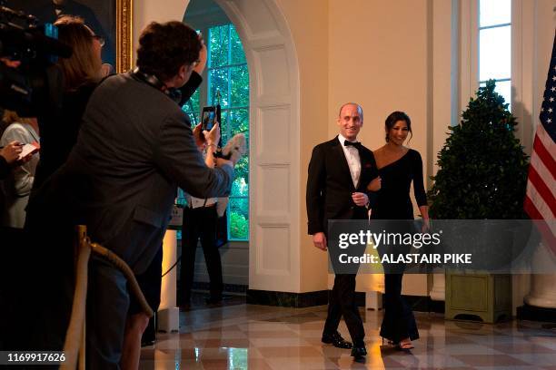 White House Senior Advisor Stephen Miller and Katie Waldman arrive in the Booksellers area of the White House to attend an Official Visit with a...