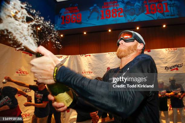 Mike Foltynewicz of the Atlanta Braves celebrates in the clubhouse with champagne at the conclusion of an MLB game against the San Francisco Giants...