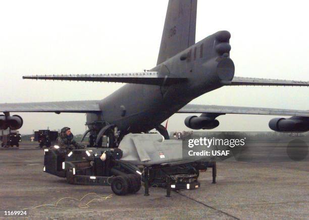 An airman secures an Air Launch Cruise Missile during a maintenance inspection aboard a B-52H Stratofortress March 25, 1999 at RAF Fairford, United...