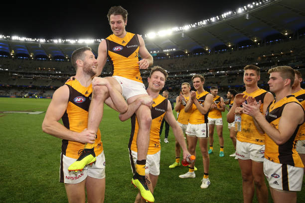 Isaac Smith of the Hawks is chaired from the ground after playing his 200th game and winning the round 23 match between the West Coast Eagles and the...
