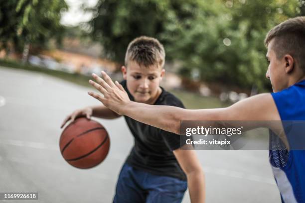 playing basketball outdoors - chinese people's liberation army stock pictures, royalty-free photos & images