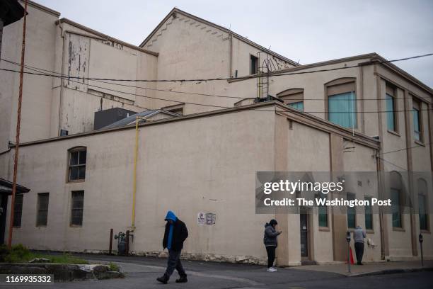 People are seen outside a methadone clinic that is located across from Taunton Police Station on Friday, May 10 in Taunton, MA. The clinic administer...