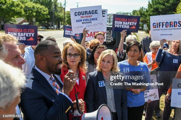 Joshua Cole, a gun safety advocate who is running for the Virginia House of Delegates to represent District 28, addresses a group of demonstrators...