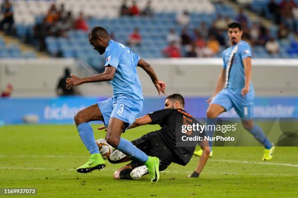 Abdelkarim Hassan pushes forward during Al Sadd v Umm Salal in the QNB Stars League on September 20 2019 in the Al Janoub Stadium, Qatar.