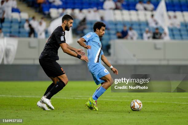 Akram Afif under pressure from Adil Rhaili during Al Sadd v Umm Salal in the QNB Stars League on September 20 2019 in the Al Janoub Stadium, Qatar.