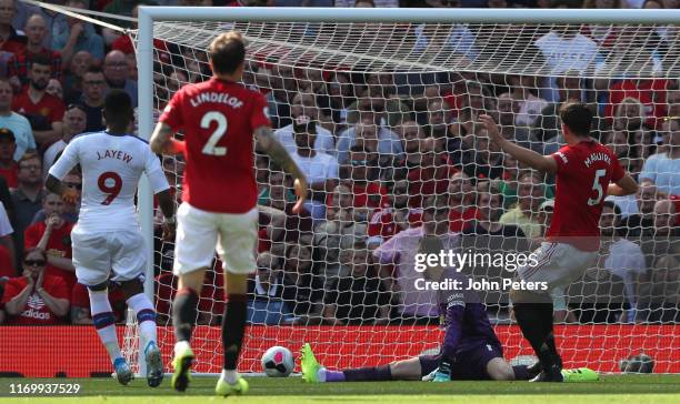 Jordan Ayew of Crystal Palace scores their first goal during the Premier League match between Manchester United and Crystal Palace at Old Trafford on...