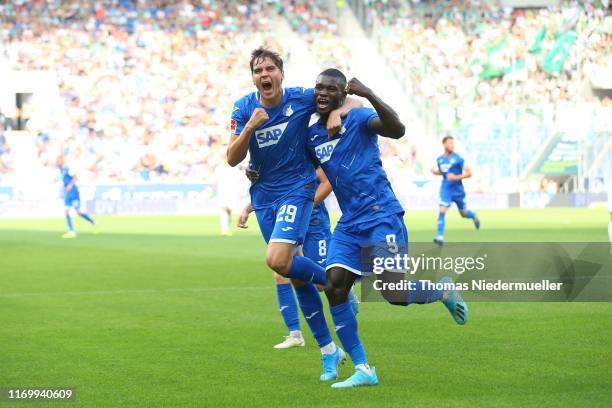 Ihlas Bebou of Hoffenheim celebrates his goal with Robert Skov during the Bundesliga match between TSG 1899 Hoffenheim and SV Werder Bremen at...