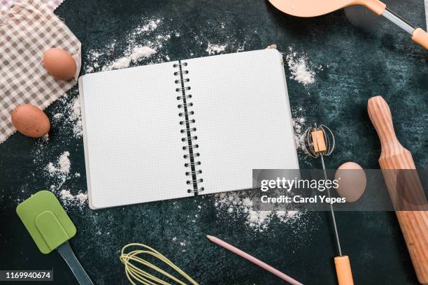 bakery ingredients and open notebook - recipe bildbanksfoton och bilder