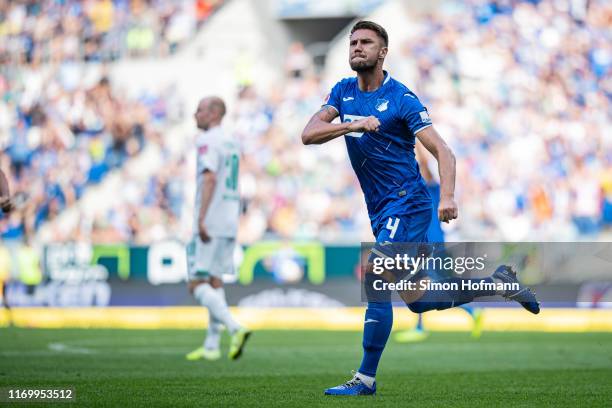 Ermin Bicakcic of Hoffenheim celebrates his team's first goal during the Bundesliga match between TSG 1899 Hoffenheim and SV Werder Bremen at...