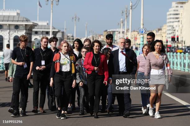 Labour leader, Jeremy Corbyn and Brighton Council leader, Nancy Platt walk with young party members along Brighton Promenade ahead of the 2019 Labour...