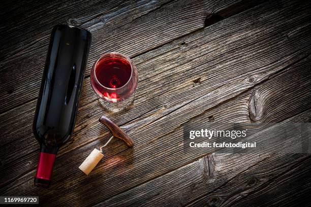wineglass, wine bottle, vintage corkscrew and cork stopper - empty wine glass top stock pictures, royalty-free photos & images