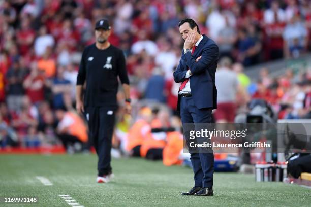 Unai Emery, Manager of Arsenal looks dejected in the final minutes of the Premier League match between Liverpool FC and Arsenal FC at Anfield on...
