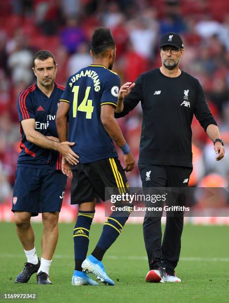 Jurgen Klopp, Manager of Liverpool consoles Pierre-Emerick Aubameyang of Arsenal following the Premier League match between Liverpool FC and Arsenal...