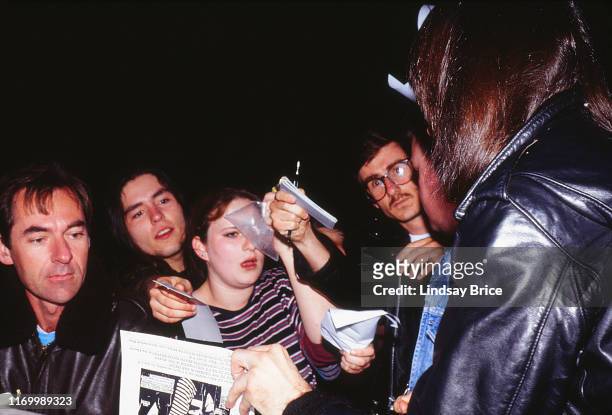 Johnny Ramone signs autographs for fans at stage door after Ramones concert at the Hollywood Palladium on March 11, 1994 in Los Angeles.
