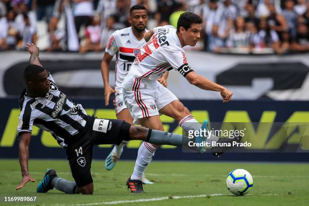 Hernanes of Sao Paulo kicks the ball on target to score the equalizer during a match between Botafogo and Sao Paulo as part of Brasileirao Series A...
