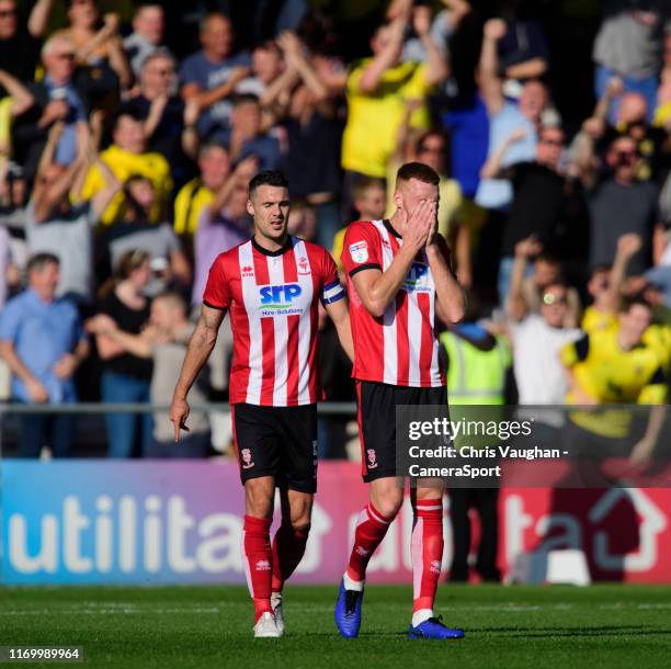 Lincoln City's Jason Shackell, left, and Lincoln City's Cian Bolger react after Oxford United's James Henry scored his side's fourth goal during the...