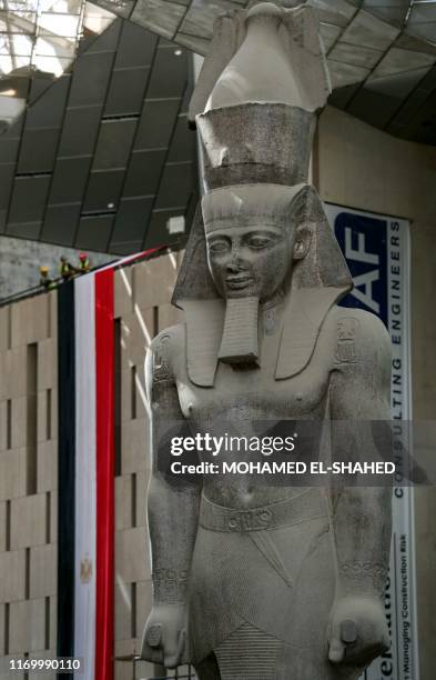 This picture taken on September 21, 2019 shows a view of the colossus of ancient Egyptian Pharaoh Ramses II, at its permanent display spot in the...