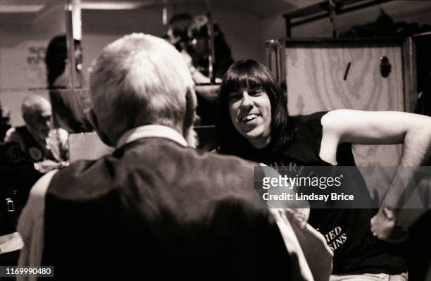 Johnny Ramone smiles as he and Timothy Leary reminisce about listening to baseball on the radio in their boyhoods backstage in dressing room before...