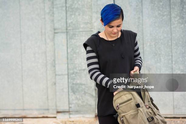 15 year old girl holding an open backpack. - open backpack stock pictures, royalty-free photos & images