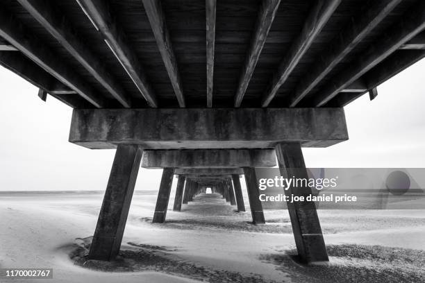 black and white, tybee beach pier, tybee island, savannah, georgia, america - tybee island stock pictures, royalty-free photos & images