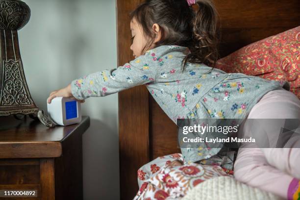 hit the snooze button - toddler girl - 3 years brunette female alone caucasian stock pictures, royalty-free photos & images