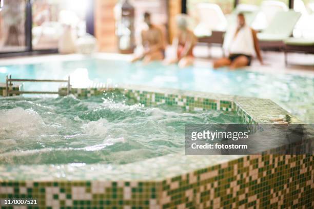 hot tub at spa resort - hot tub stock pictures, royalty-free photos & images
