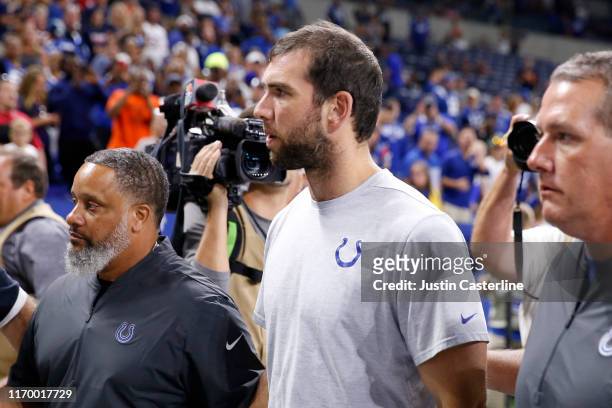 Andrew Luck of the Indianapolis Colts walks off the field after the Indianapolis Colts preseason game against the Chicago Bears after it was reported...